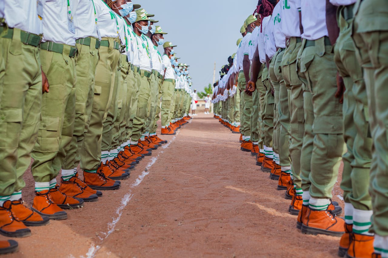 services-01 A group of uniformed personnel standing in formation outdoors, showcasing discipline and unity.